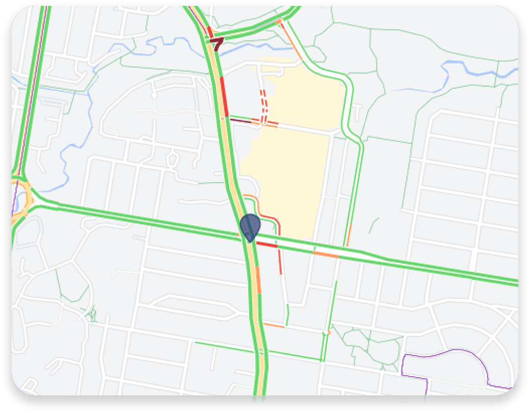 Geographic information system (GIS) map with marker and live traffic highlights.